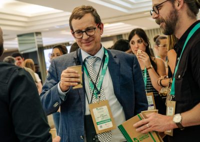 DNSG 2026 organisers and participants talking over coffee during a break between scientific sessions.