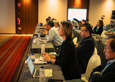 Symposium attendees taking notes and listening attentively during a scientific lecture at DNSG 2026.