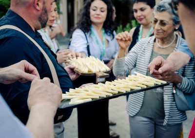 DNSG 2026 participants enjoying a cheese tasting during the outdoor welcome reception.