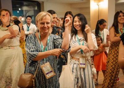 DNSG 2026 participants smiling and dancing together during the symposium’s social evening.